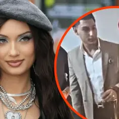 Viki Gabor w eleganckim stroju, obok niej mężczyzna w garniturze, być może jej mąż.